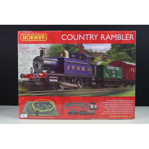 83 - Two boxed Hornby OO gauge electric train sets to include sealed R1249 Country Rambler and R1248 Sant... 