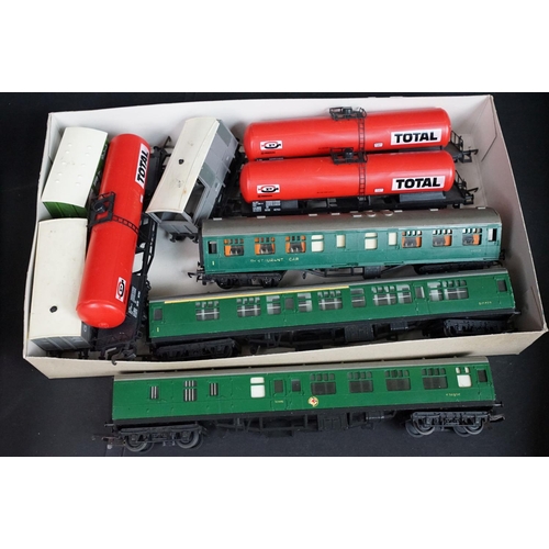 154 - Around 75 OO gauge items of rolling stock to include Triang, Hornby and Lima featuring coaches, wago... 