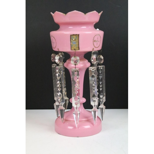 73 - Pair of Victorian pink glass lustres with painted floral decoration and prismatic drops. 31cm tall.