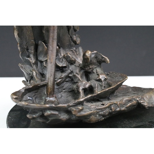 114 - 20th century bronze sculpture modelled with two figures in a sailing boat with wave crashing, inscri... 