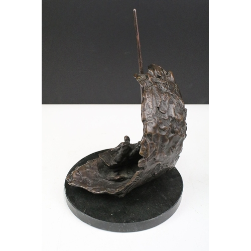 114 - 20th century bronze sculpture modelled with two figures in a sailing boat with wave crashing, inscri... 