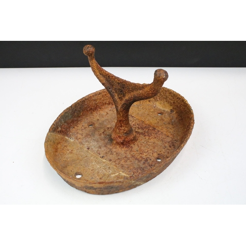 117 - 19th century cast iron boot scraper with oval tray base, 32cm long