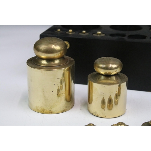 118 - Cased set of thirteen brass weights, ranging from 1 gram to 1 kilogram