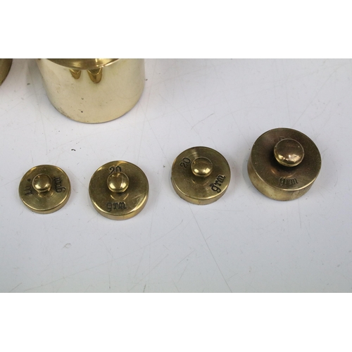 118 - Cased set of thirteen brass weights, ranging from 1 gram to 1 kilogram