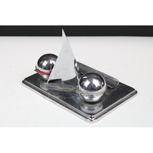 129 - Art Deco chrome nautical themed standish or desk stand, the rectangular base set with two globular i... 