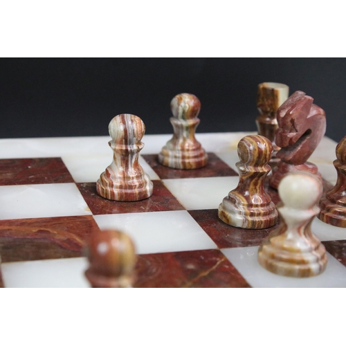 130 - Marble / alabaster chess board with chess set (32 pieces), the board 39.5 x 40.5cm (excluding wooden... 