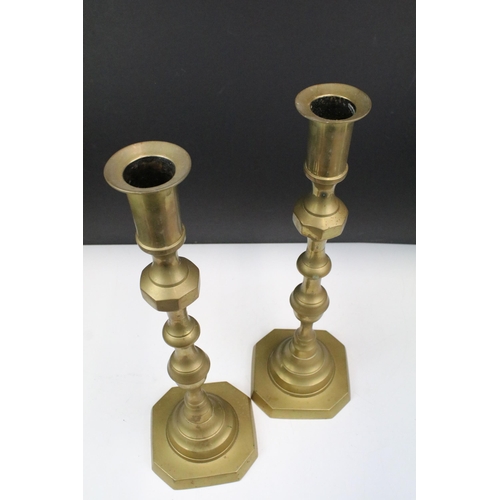 134 - Pair of 20th century brass candlesticks of large proportions, 47.5cm high