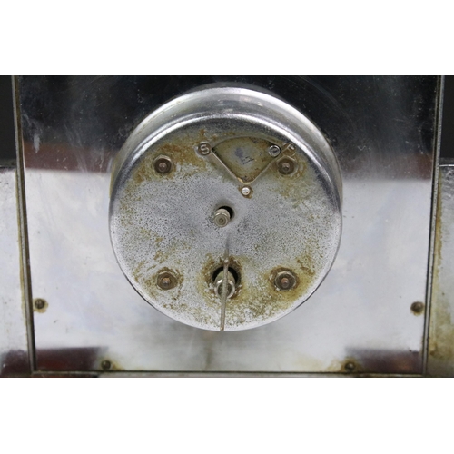 136 - Art Deco chrome and Bakelite 8 day mantle clock, the square face held on a stepped base, 22cm wide