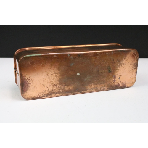 167 - Copper planter of rectangular form with rolled rim and curved ends, 30cm long