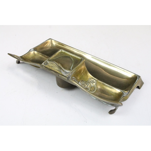 169 - Art Nouveau brass standish or desk stand with central single inkwell, 26cm long