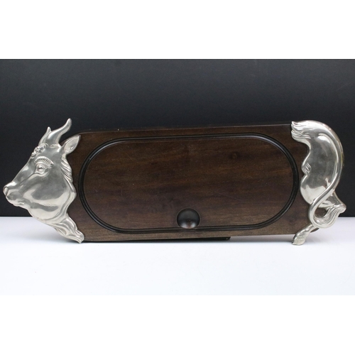 173 - French white metal and hardwood charcuterie board in the form of a bull, 61cm long