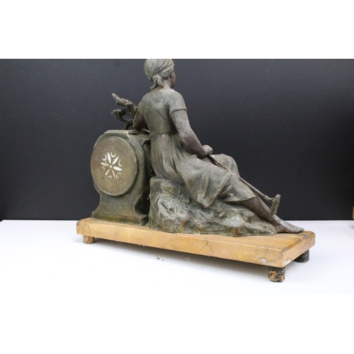 174 - Early 20th century clock garniture in spelter, cast metal in form of young farm girl sat on corn tog... 