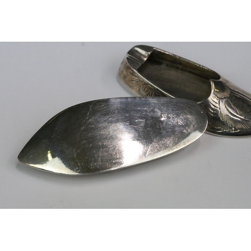 180 - A pair of Indian silver miniature ashtrays in the form of slippers.