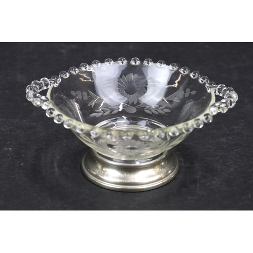 182 - Sterling silver and glass twin handled bowl with glass beaded edge and etched with flowers raised on... 