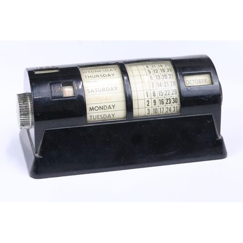 183 - Mid 20th century black cased perpetual calendar, 15cm long