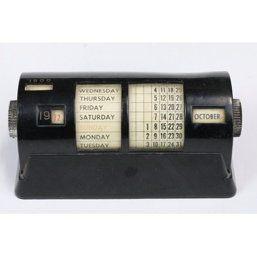 183 - Mid 20th century black cased perpetual calendar, 15cm long