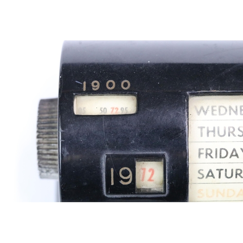 183 - Mid 20th century black cased perpetual calendar, 15cm long