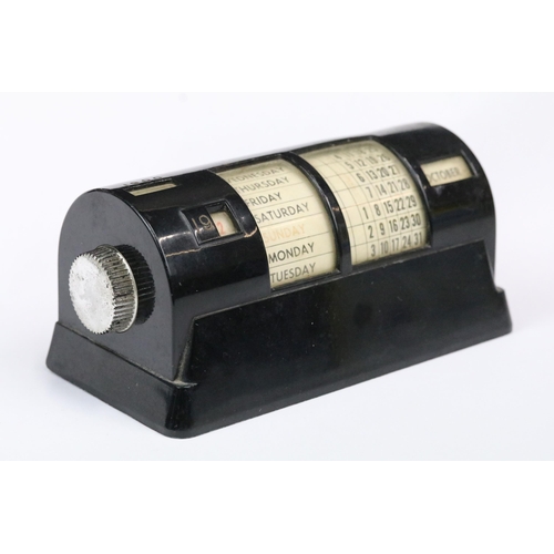 183 - Mid 20th century black cased perpetual calendar, 15cm long