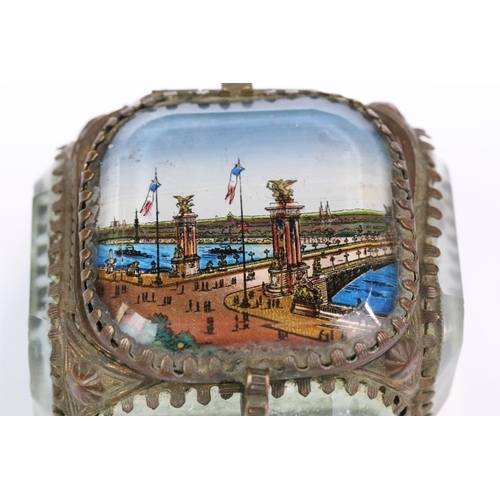 186 - An antique French jewellery glass casket with Parisian scene to top panel.