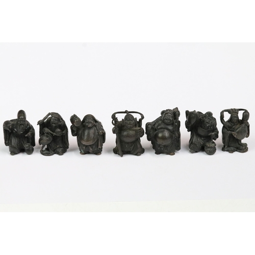 188 - Cast bronze Japanese' Seven Lucky Gods' figurines, each figure with moulded each measuring approx 4.... 