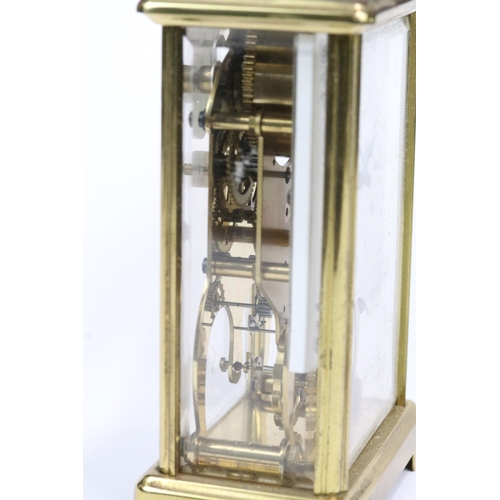 195 - A early 20th century brass cased carriage clock with beveled glass panels together with a mid 20th c... 