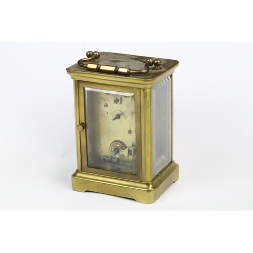 195 - A early 20th century brass cased carriage clock with beveled glass panels together with a mid 20th c... 