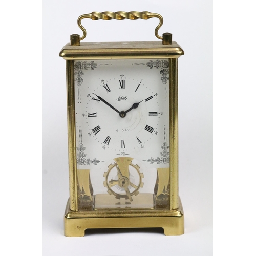 195 - A early 20th century brass cased carriage clock with beveled glass panels together with a mid 20th c... 