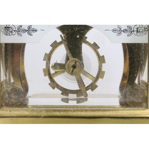 195 - A early 20th century brass cased carriage clock with beveled glass panels together with a mid 20th c... 