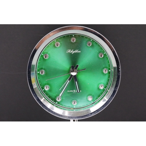 200 - A mid 20th century Rhythm 2 jewel Japanese made alarm clock with green metallic dial.