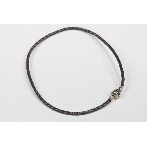 202 - Pandora - Pandora silver snake chain bracelet, together with Pandora leather bracelet with Pandora s... 