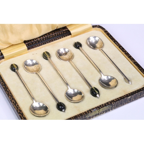 205 - A cased set of six fully hallmarked sterling silver coffee bean spoons together with a silver plated... 