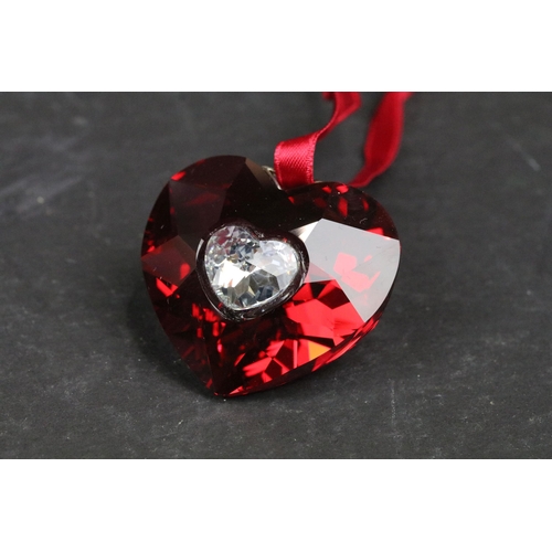 206 - A Swarovski red heart hanging decoration, set within fitted case and complete with outer box.