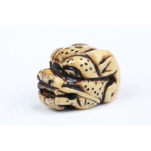 207 - Four carved bone miniature netsuke figures to incude signed dragons head, snake coiled around gold, ... 