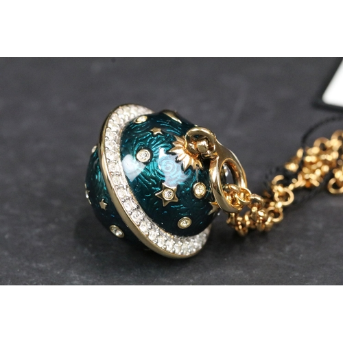 209 - A Swarovski jeweler's collection necklace with enamel planet shaped pendant, complete with display c... 