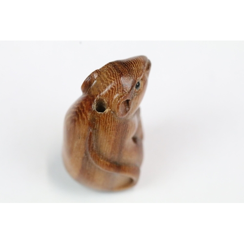 210 - Four carved wood miniature netsuke figures to include signed dog, mouse with nut, rabbit and hen