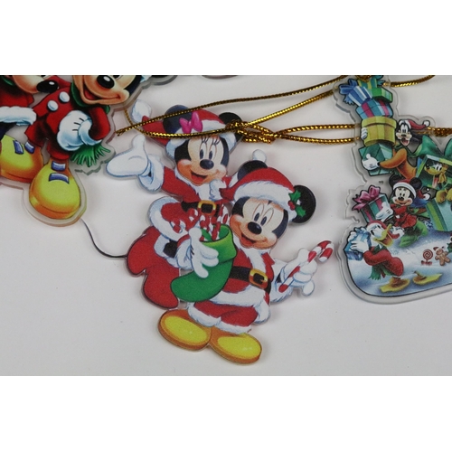 214 - A collection of Disney Christmas decorations featuring various well know characters to include Micke... 