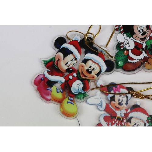 214 - A collection of Disney Christmas decorations featuring various well know characters to include Micke... 