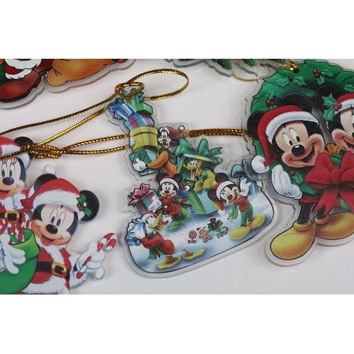 214 - A collection of Disney Christmas decorations featuring various well know characters to include Micke... 