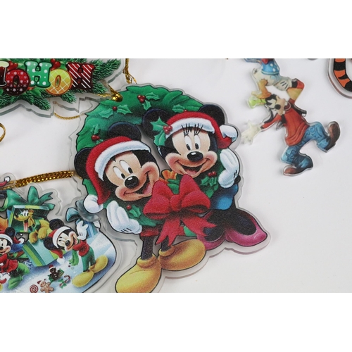 214 - A collection of Disney Christmas decorations featuring various well know characters to include Micke... 