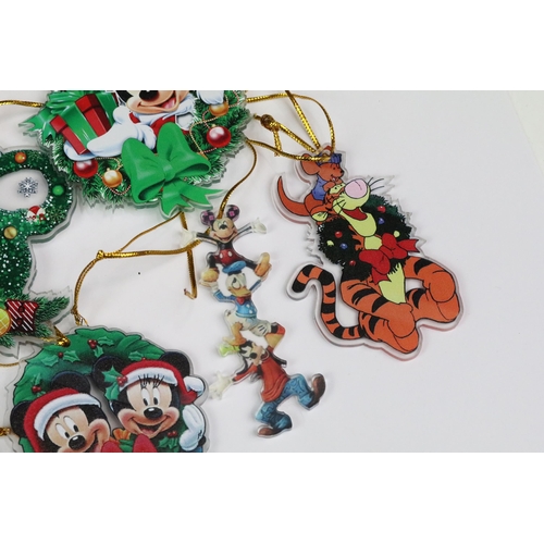 214 - A collection of Disney Christmas decorations featuring various well know characters to include Micke... 