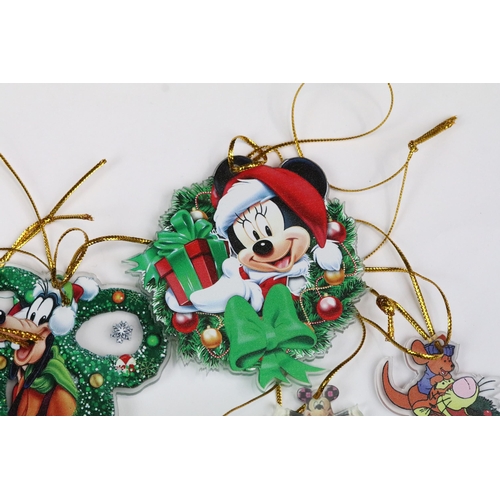 214 - A collection of Disney Christmas decorations featuring various well know characters to include Micke... 