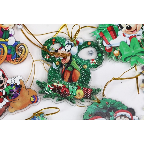 214 - A collection of Disney Christmas decorations featuring various well know characters to include Micke... 