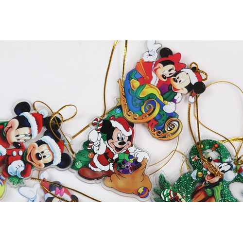 214 - A collection of Disney Christmas decorations featuring various well know characters to include Micke... 