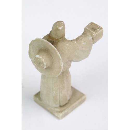 219 - A collection of miniature ornamental animal figures together with a carved stone oriental figure.