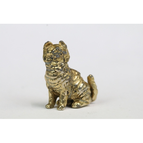 219 - A collection of miniature ornamental animal figures together with a carved stone oriental figure.