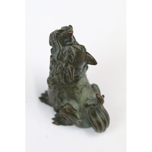 222 - A ornamental Chinese bronze dog of foo figure, stands approx 5cm in height.