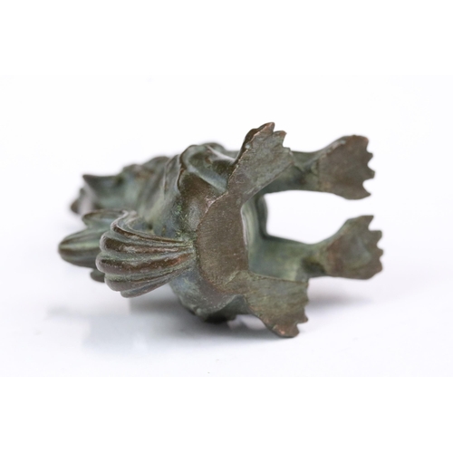 222 - A ornamental Chinese bronze dog of foo figure, stands approx 5cm in height.