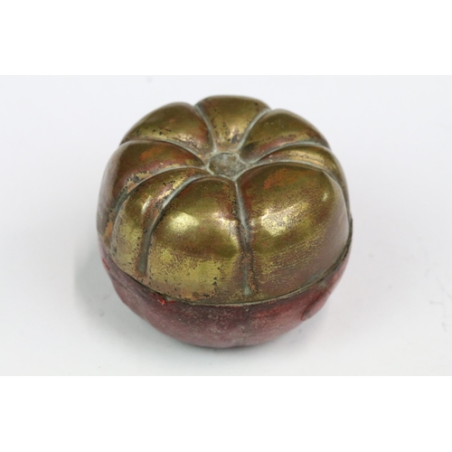 223 - An early 20th century travelling inkwell of fruit form with leather covered base together with a Jad... 