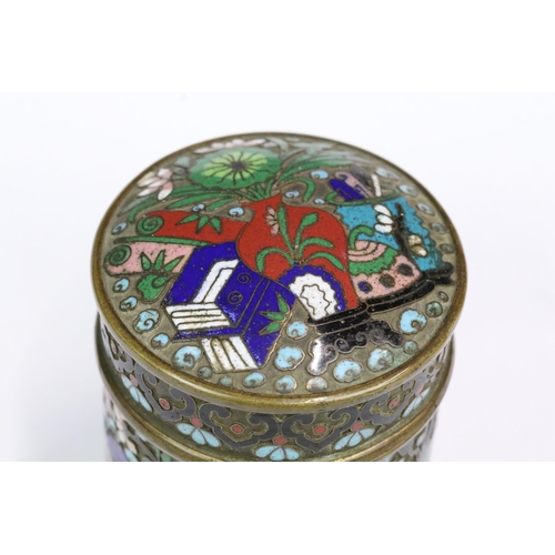 225 - A Chinese decorative cloisonne enamel lidded jar, stands approx 10cm in height.