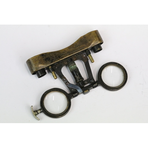 226 - A pair of early 20th century leather covered (A/F) folding opera glasses.